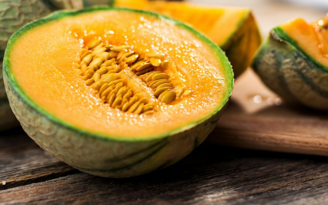 Fresh melons on wooden table